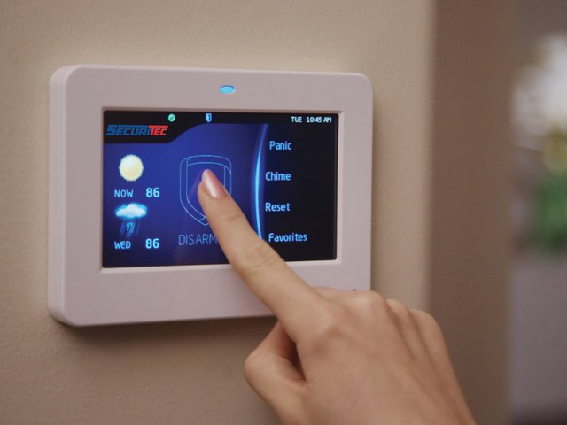 Securitec Touchscreen Keypad with finger.jpg