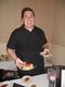 Chef-Joe-Gallagher,-of-D'Agnese's,-serves-artichoke-hearts-in-lemon-butter-and-crostini-with-olive-oil,-sausage,-tomato-and-micro-greens..jpg