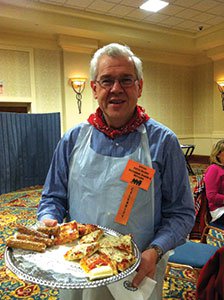 Celebrity-server-Attorney-Patrick-Weschler-offers-pizza-to-guests..jpg