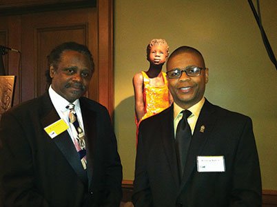 Honoree-Woodrow-Nash-and-his-son,-Woodrow-Nash-Jr.,-in-front-of-Nash's-sculpture.jpg