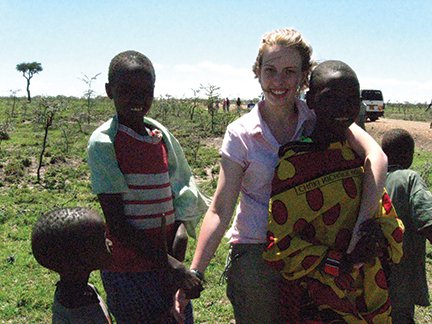 Masai children came out of nowhere to visit while our drivers fixed the flat tires on our way to the Masai Mara. They were amazed with Becky's white skin..JPG