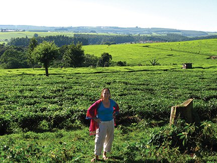 The author standing in front of a tea plantation in the mountains of Kenya. Best tea ever..JPG