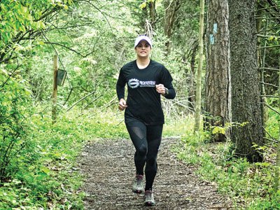 Stacy Rhea running along Peninsula Pine Lane